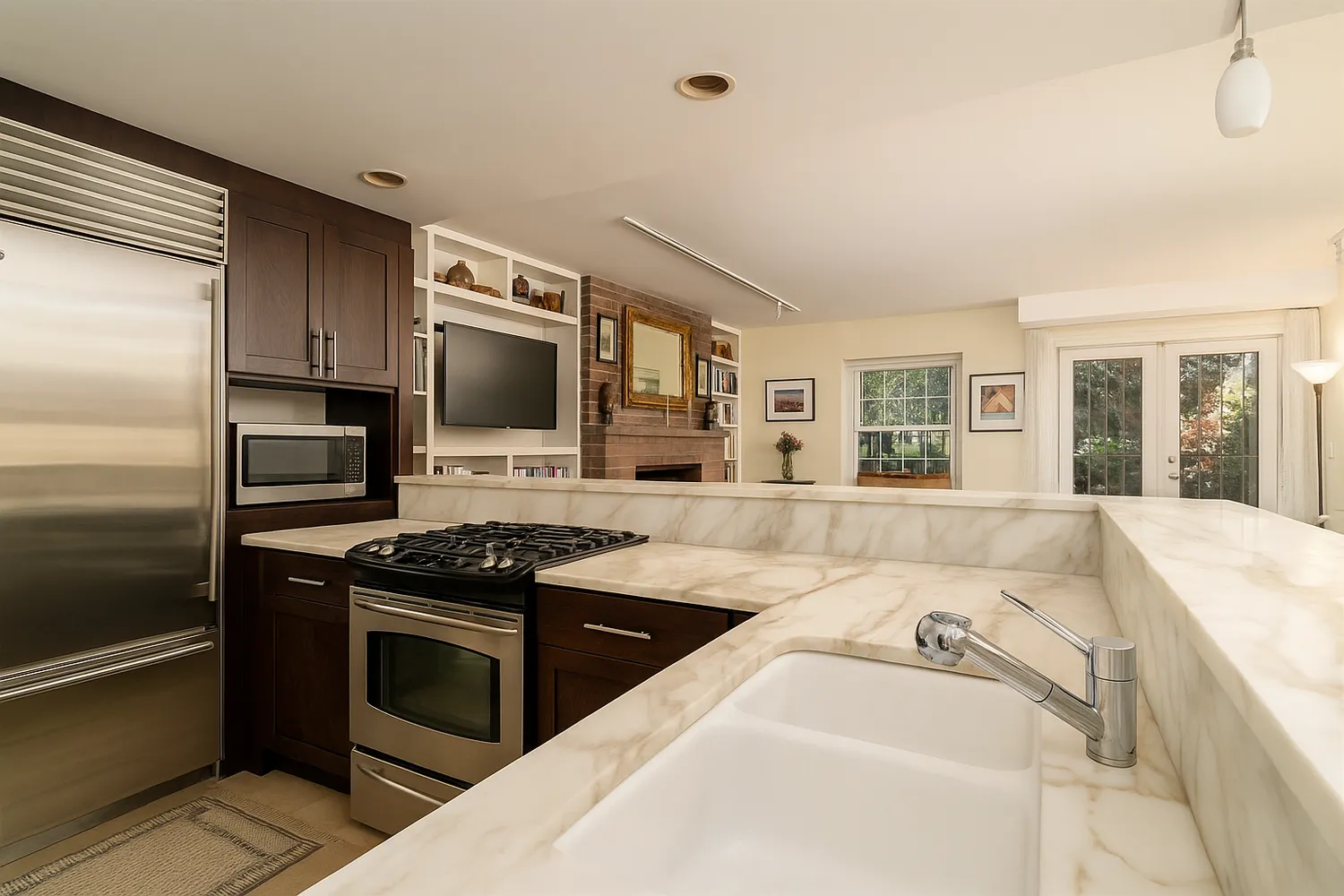 a kitchen with stainless steel appliances granite countertop a sink and a stove top oven
