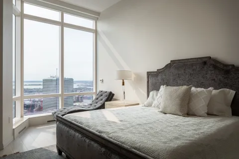 a view of a kitchen with a large window