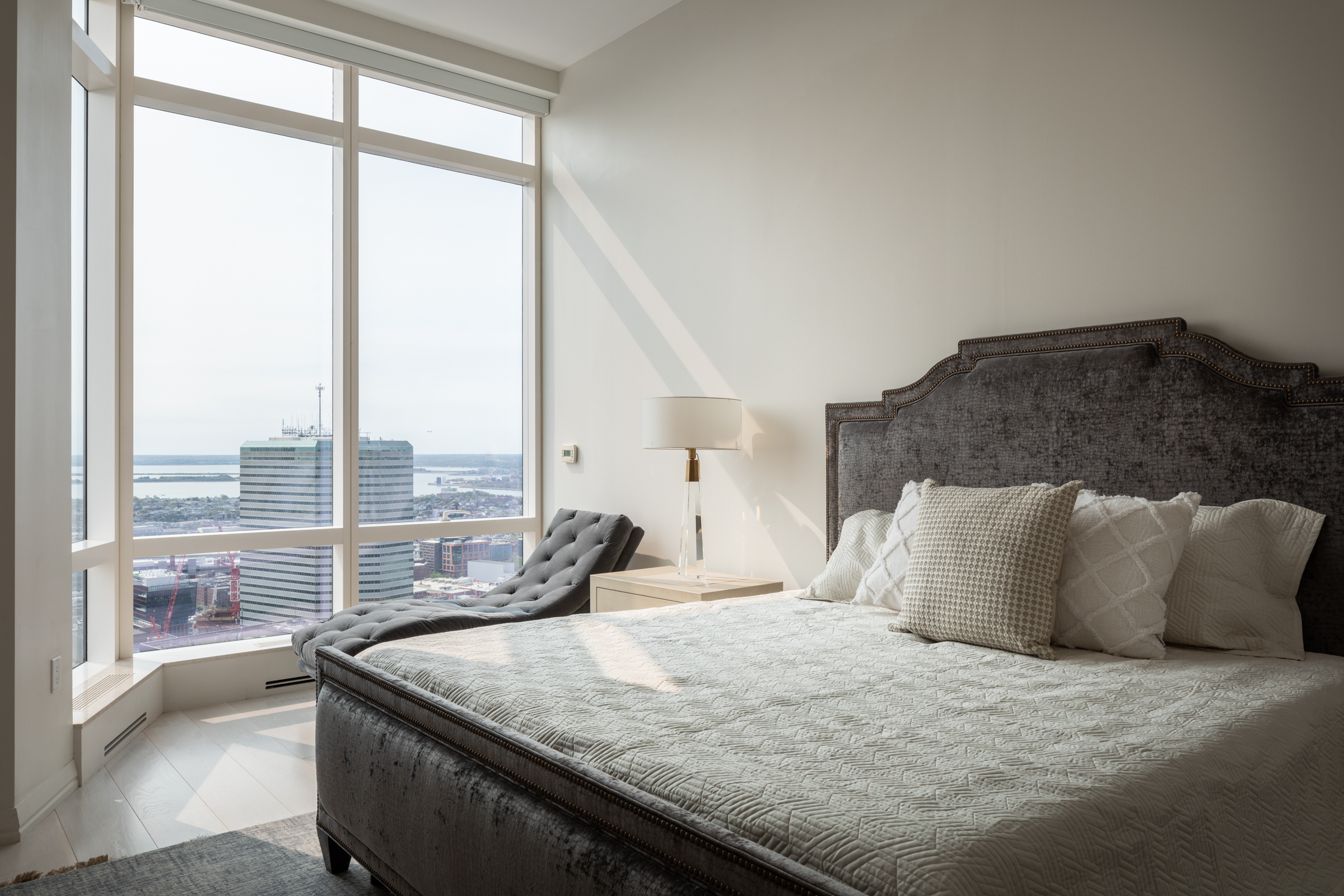 1 Franklin Street, Unit PH2D Boston, MA 02110 - Photo 19 of 26 a bedroom with a large window and a balcony