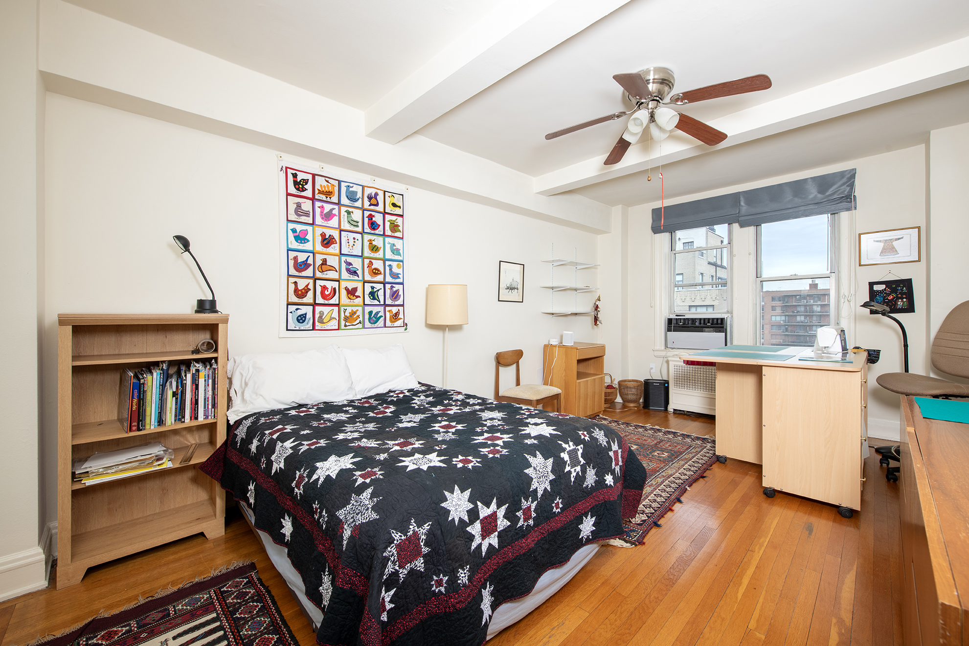 12 West 96th Street, Unit 16A Manhattan, NY 10025 - Photo 6 of 13 a bedroom with a bed next to a large window with the outer view