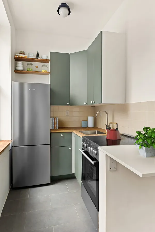 a kitchen with stainless steel appliances a refrigerator sink and stove