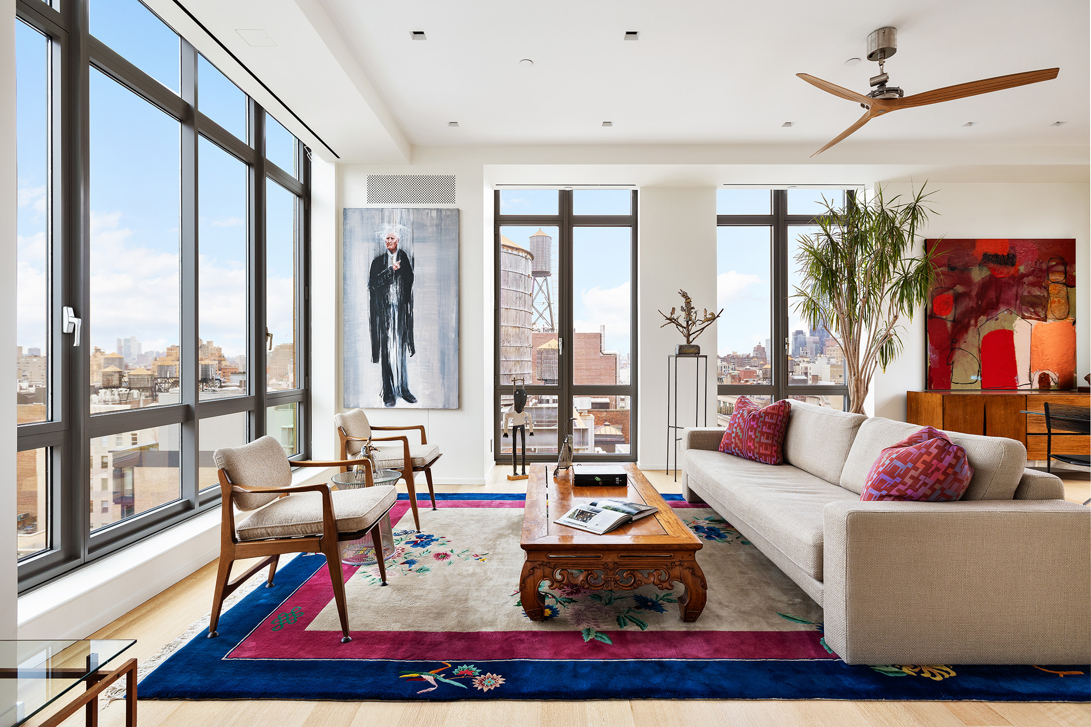 4 West 21st Street, Unit PH Manhattan, NY 10010 - Photo 2 of 14 a living room with furniture large window and rug