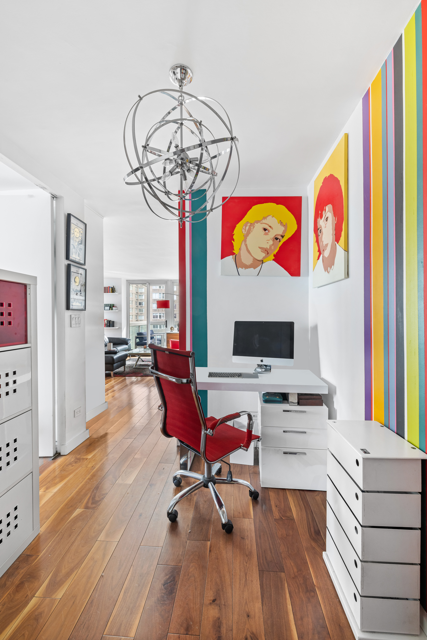 61 West 62nd Street, Unit 16D Manhattan, NY 10023 - Photo 9 of 11 a workspace with furniture wooden floor and a chandelier