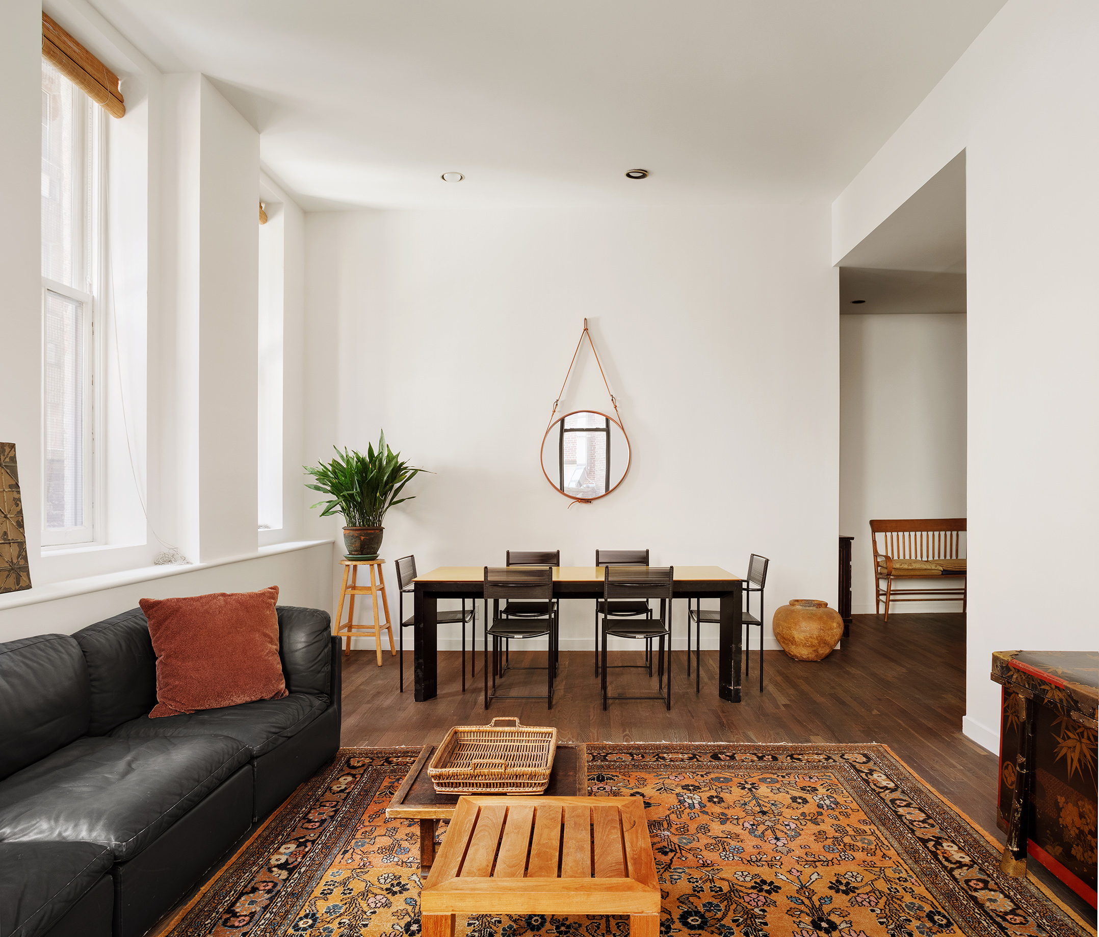 115 4th Avenue, Unit 2I Manhattan, NY 10003 - Photo 3 of 12 a living room with furniture a dining table and a potted plant