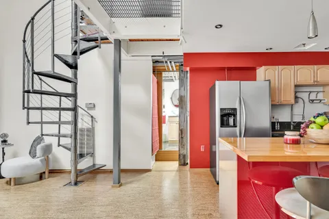 a view of a hallway with washer and dryer