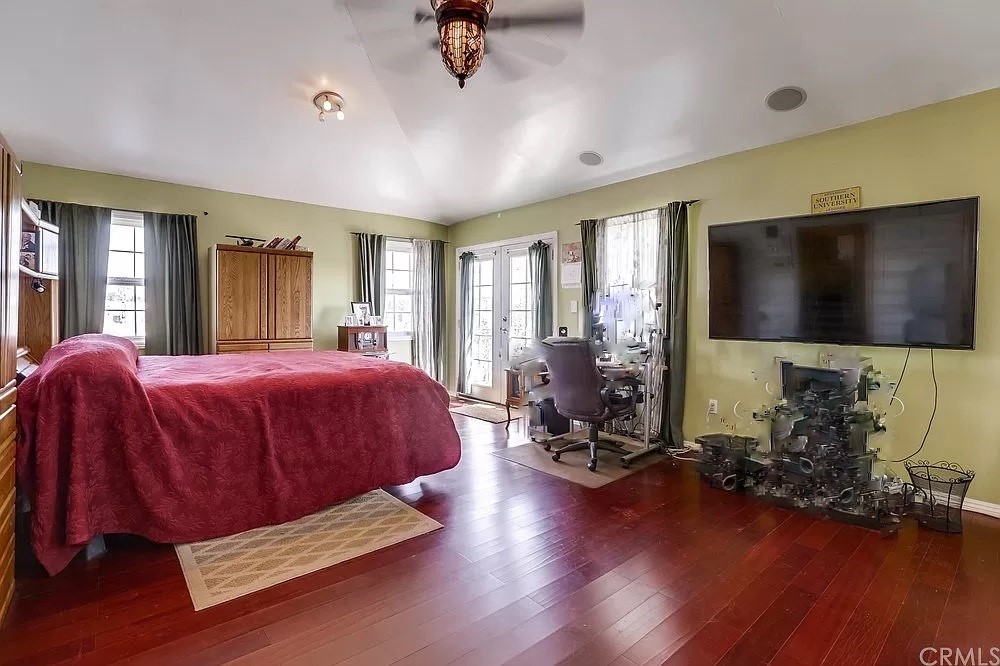 15604 Deblynn Avenue Gardena, CA 90248 - Photo 18 of 22 a spacious bedroom with a bed and wooden floor