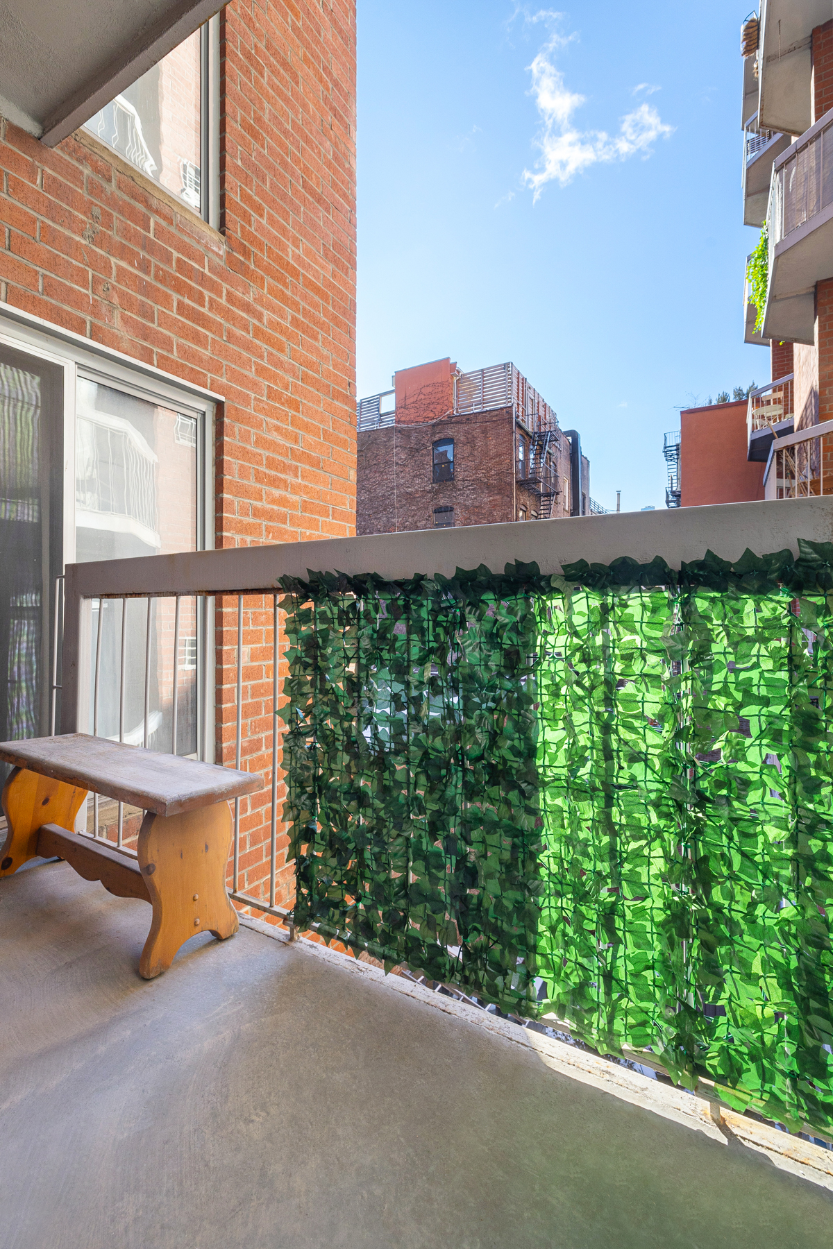 184 Thompson Street, Unit 2V Manhattan, NY 10012 - Photo 7 of 8 a view of a balcony with an outdoor space and seating area