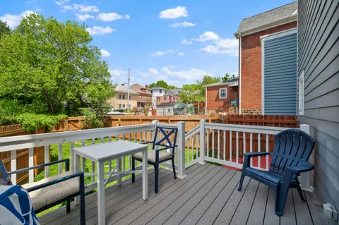 a view of a chairs on the roof deck
