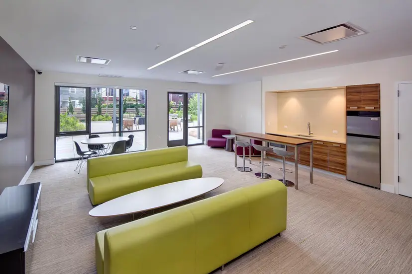 22 Caton Place, Unit 4H Brooklyn, NY 11218 - Photo 10 of 20 a living room with furniture and a flat screen tv