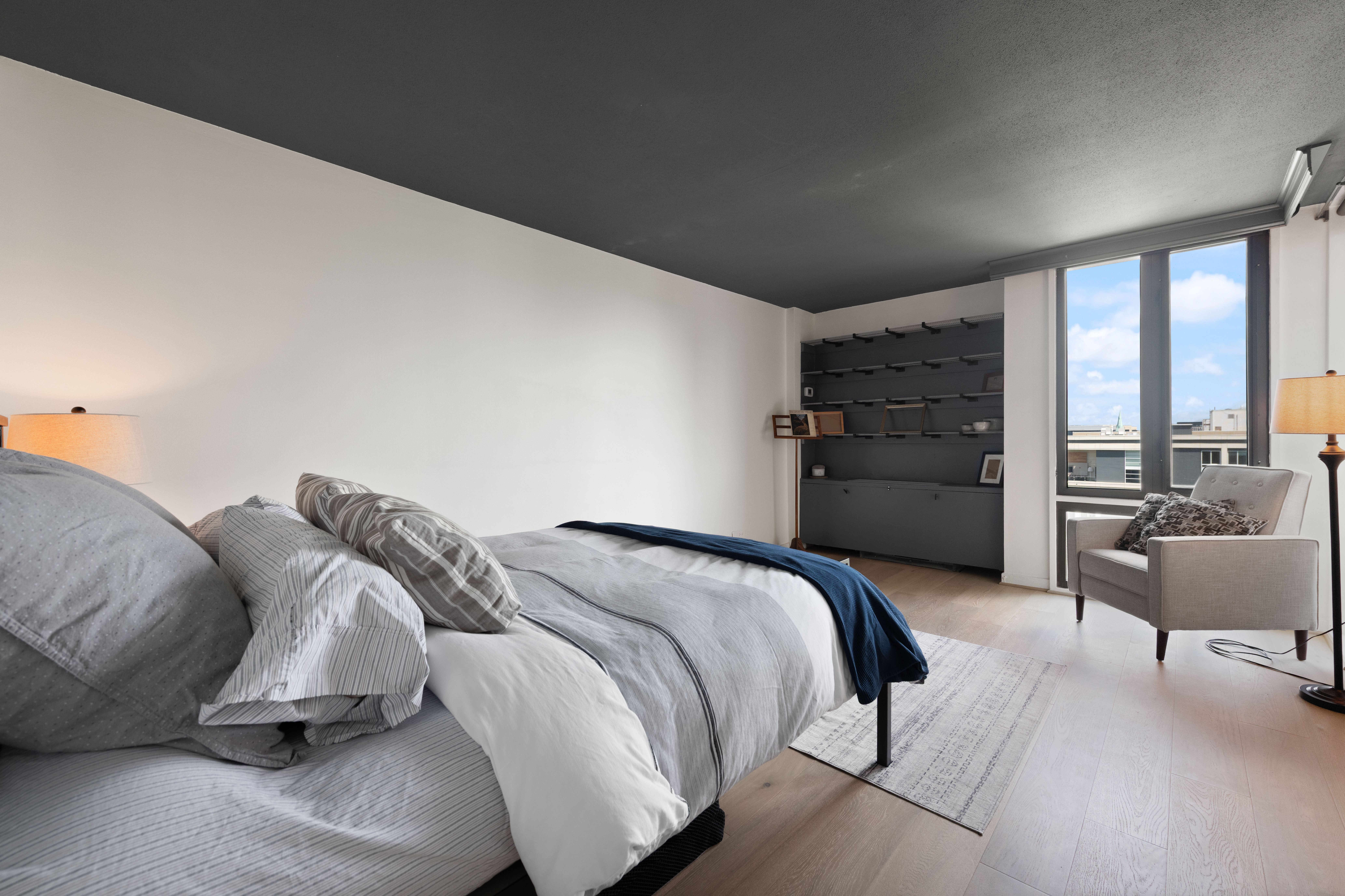 490 M Street Southwest, Unit W802 Washington, DC 20024 - Photo 9 of 24 a bedroom with a bed and glass door