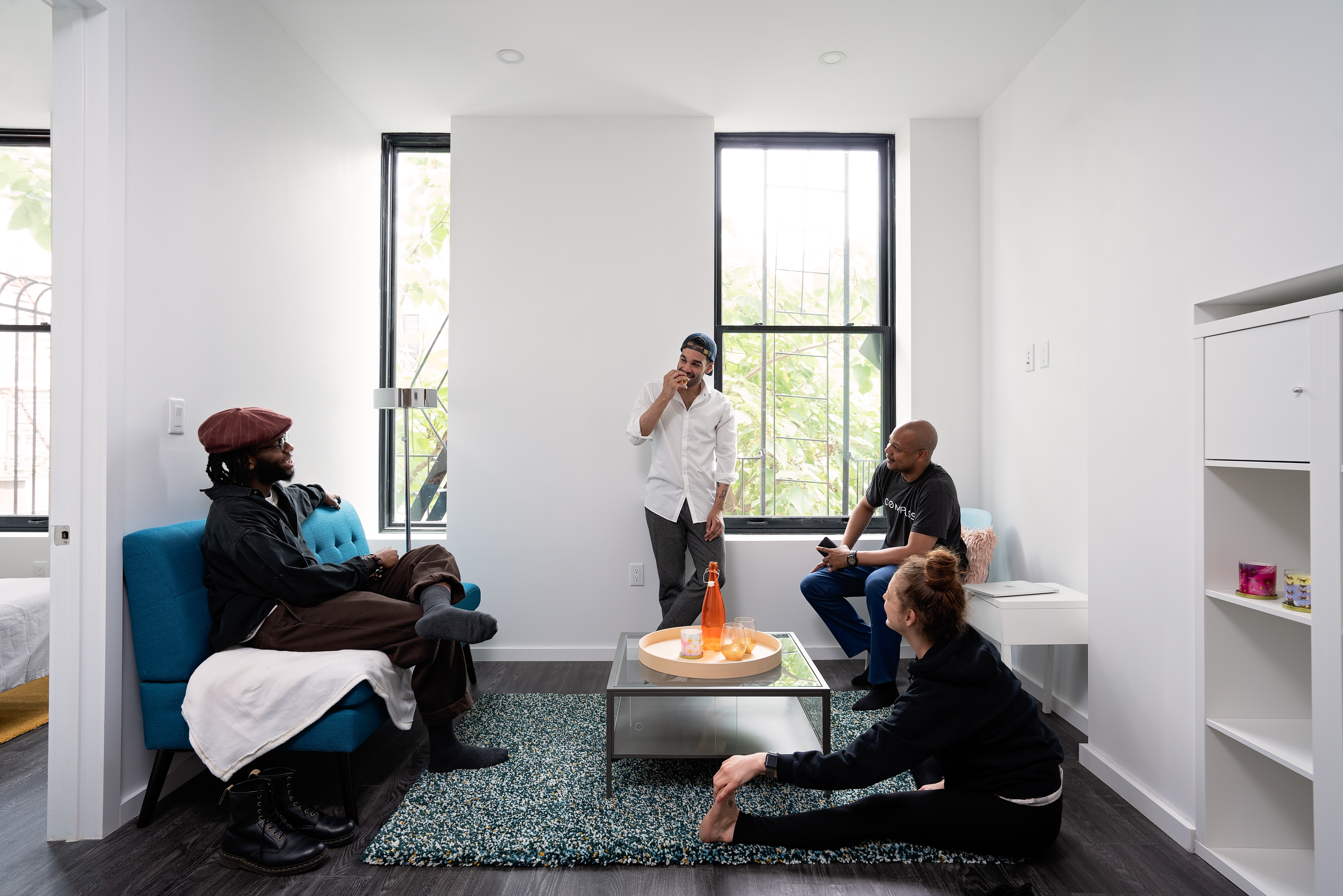 415 Broadway, Unit 3A Brooklyn, NY 11211 - Photo 3 of 8 a living room with furniture and a window