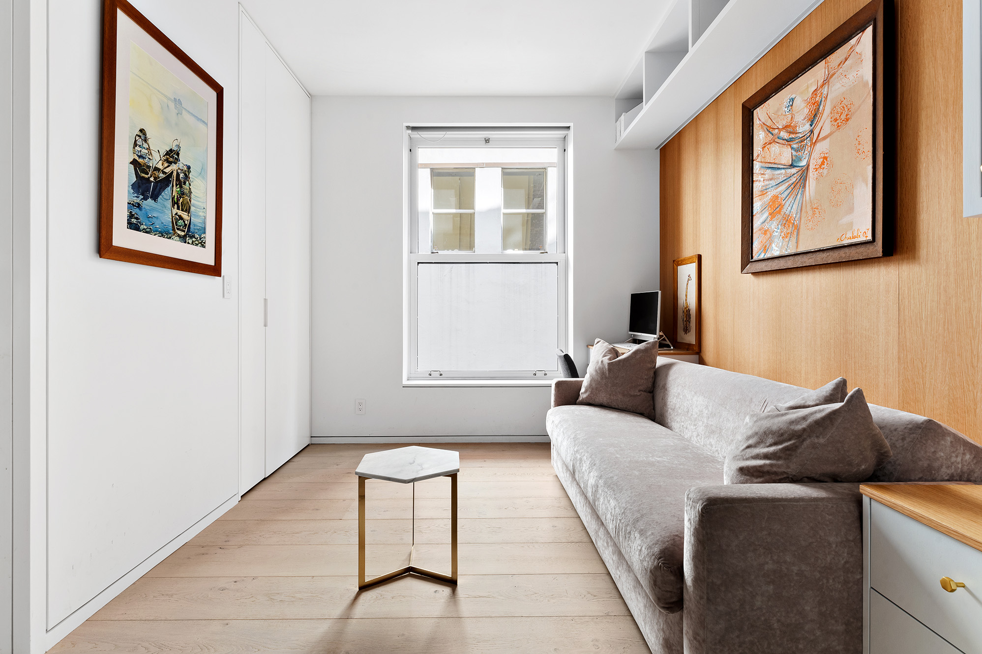 26 West 20th Street, Unit 3 Manhattan, NY 10011 - Photo 12 of 19 a living room with furniture and a window