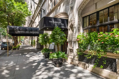a view of a building with potted plants