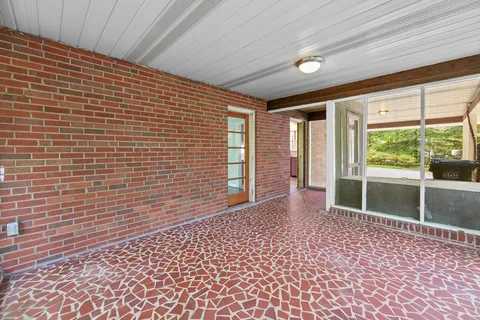 a view of empty room with windows