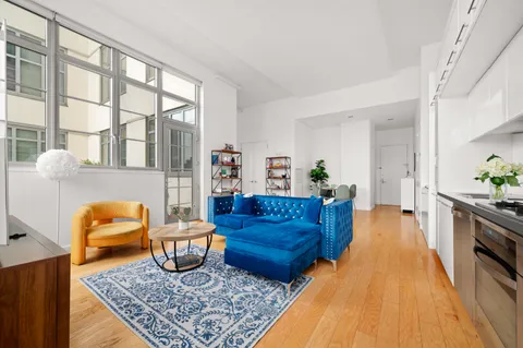 a living room with furniture and a rug
