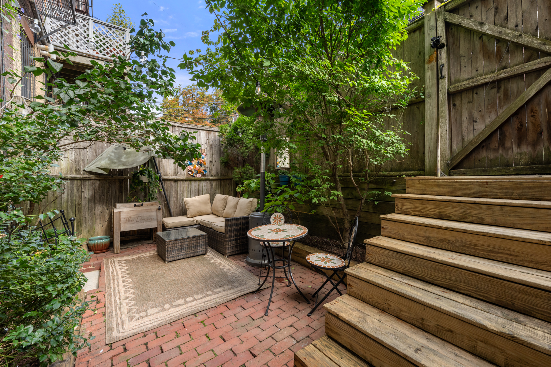 484 Massachusetts Avenue, Unit 1 Boston, MA 02118 - Photo 15 of 20 a view of backyard with seating area and trees