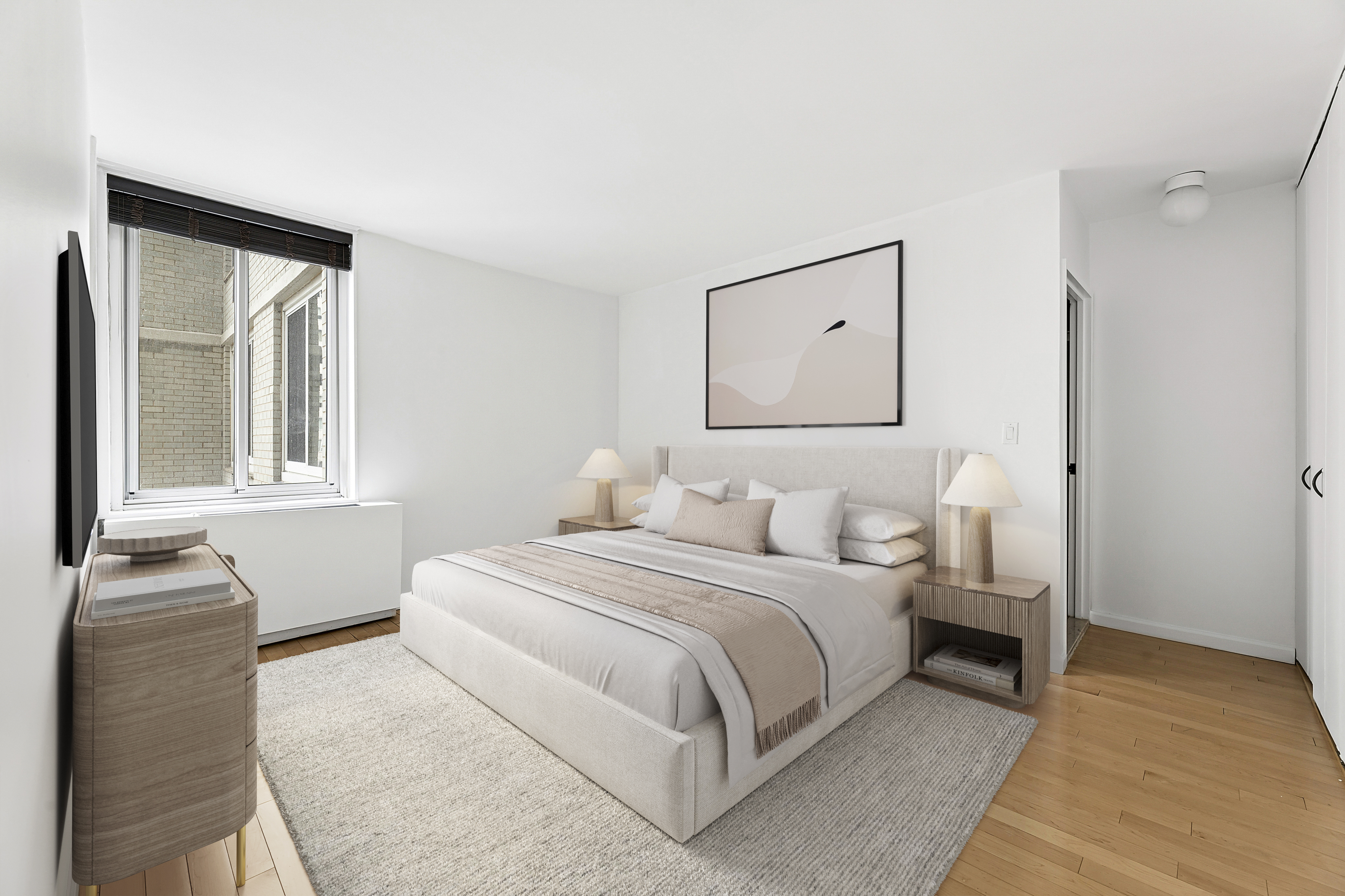220 East 65th Street, Unit 8J Manhattan, NY 10065 - Photo 4 of 13 a bedroom with a bed and a window