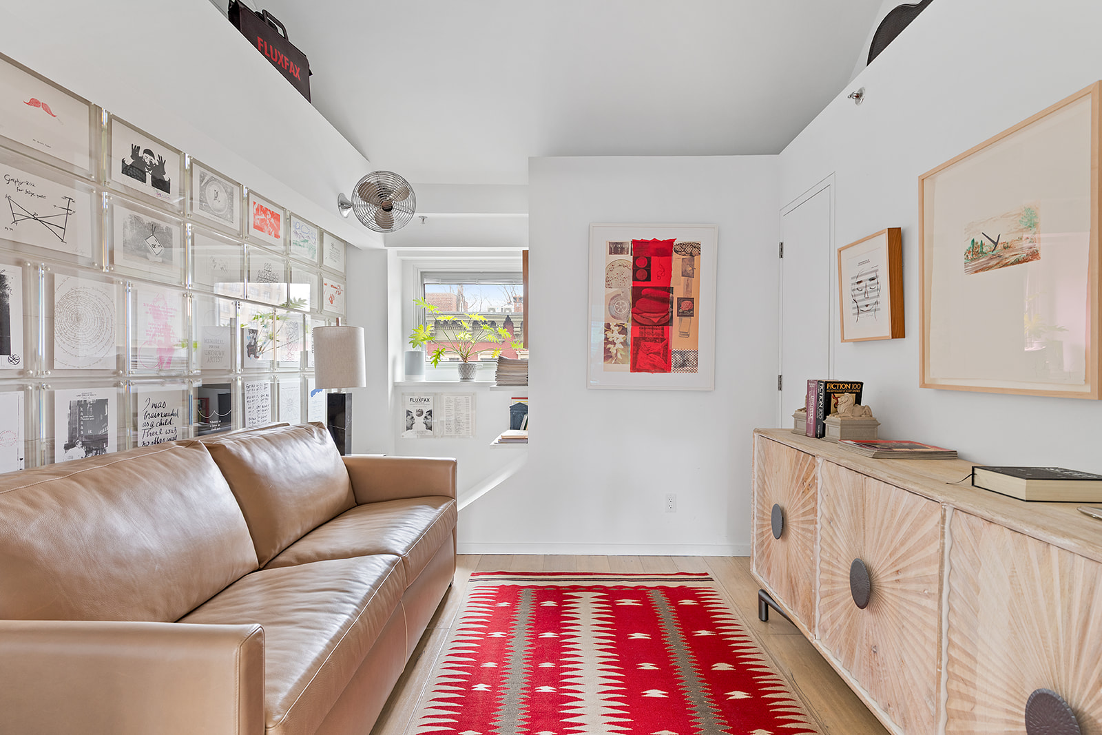 357 West 12th Street, Unit 5E Manhattan, NY 10014 - Photo 7 of 13 a living room with furniture and a rug