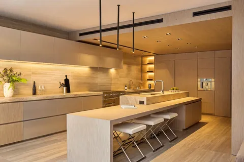 a kitchen with a sink and wooden floor