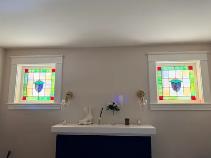 a bathroom with a sink mirror and wall painting
