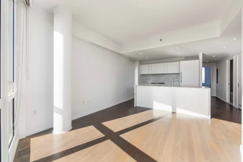 a kitchen with a refrigerator and a sink