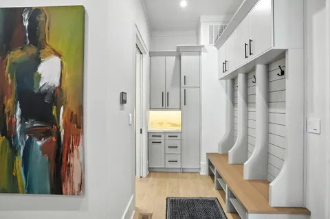 a room with gym equipment and view of living room