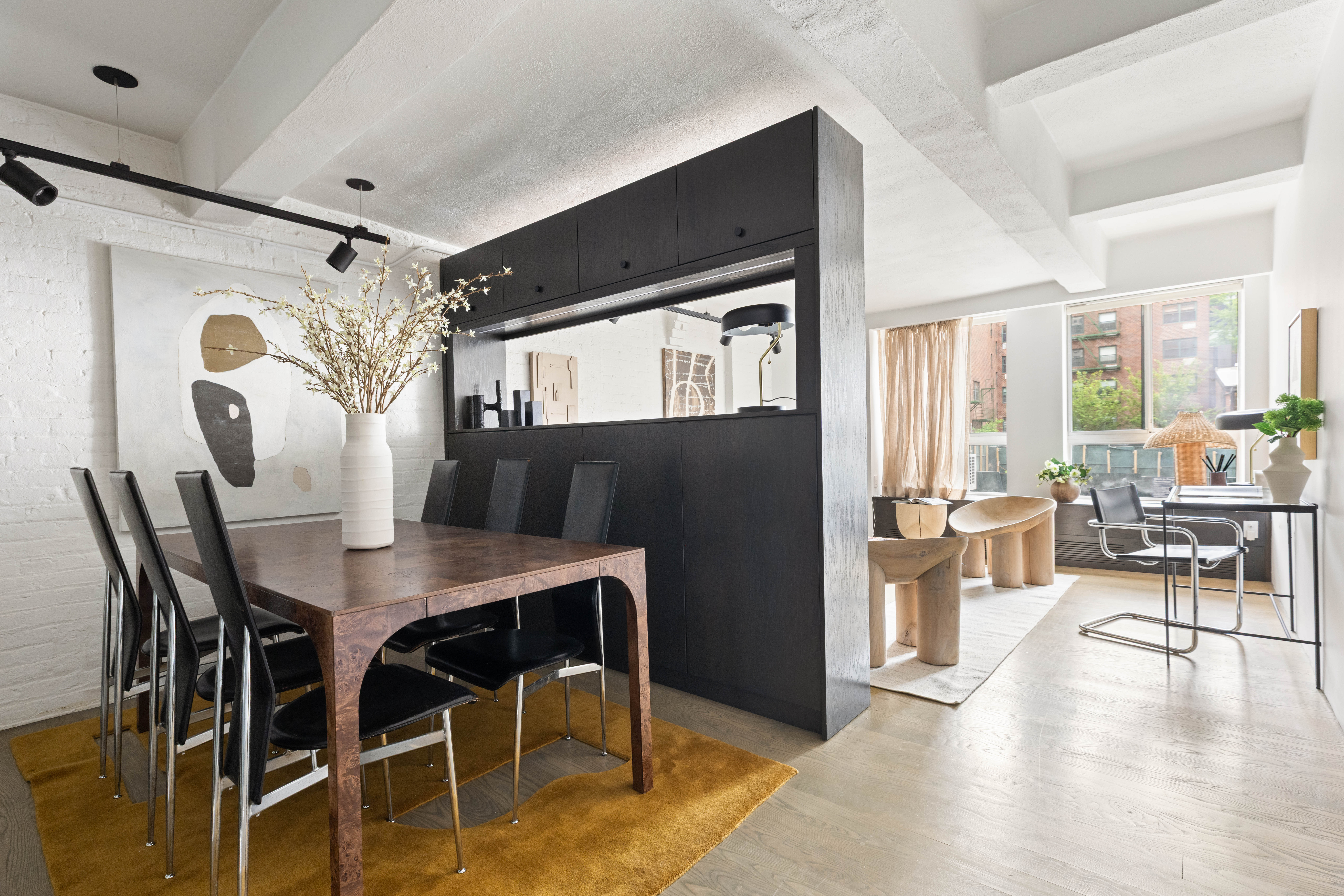 165 Perry Street, Unit 1D Manhattan, NY 10014 - Photo 2 of 13 a view of a dining room with furniture and wooden floor