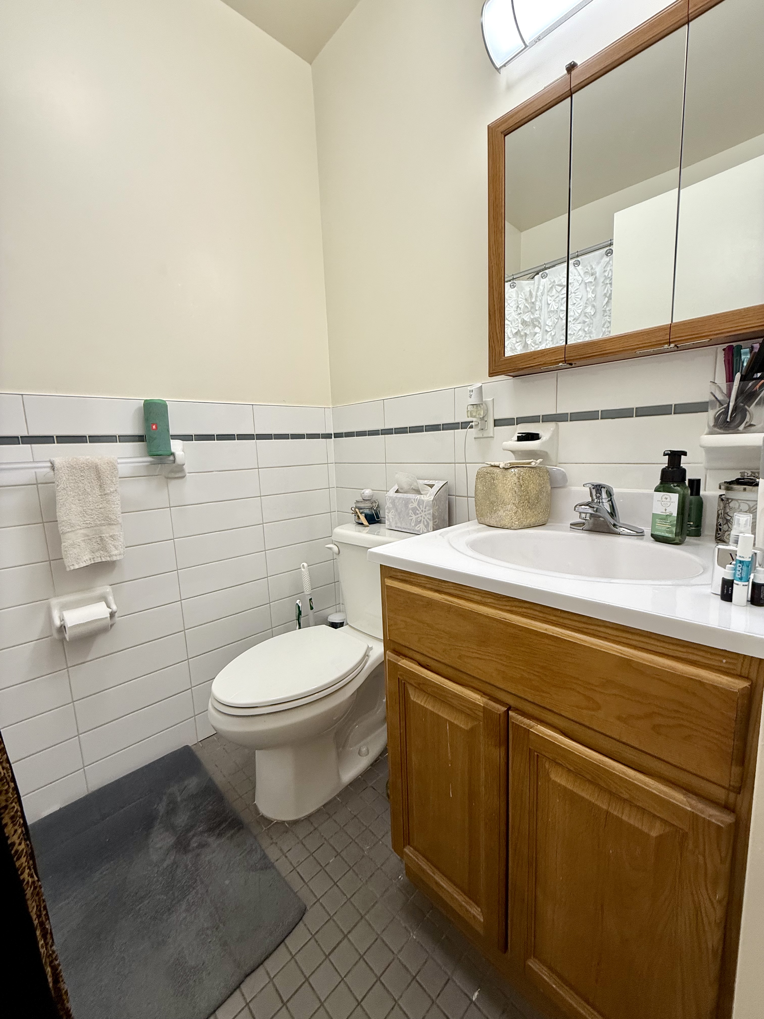 Convent Avenue Manhattan, NY 10031 - Photo 9 of 12 a bathroom with a toilet a sink and mirror