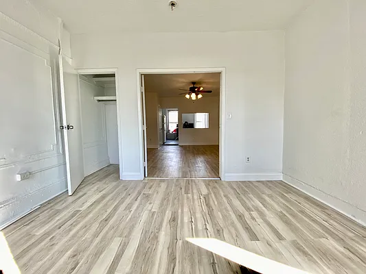 591 Vanderbilt Avenue, Unit 4 Brooklyn, NY 11238 - Photo 8 of 10 a view of a room with wooden floor and a bathroom sink