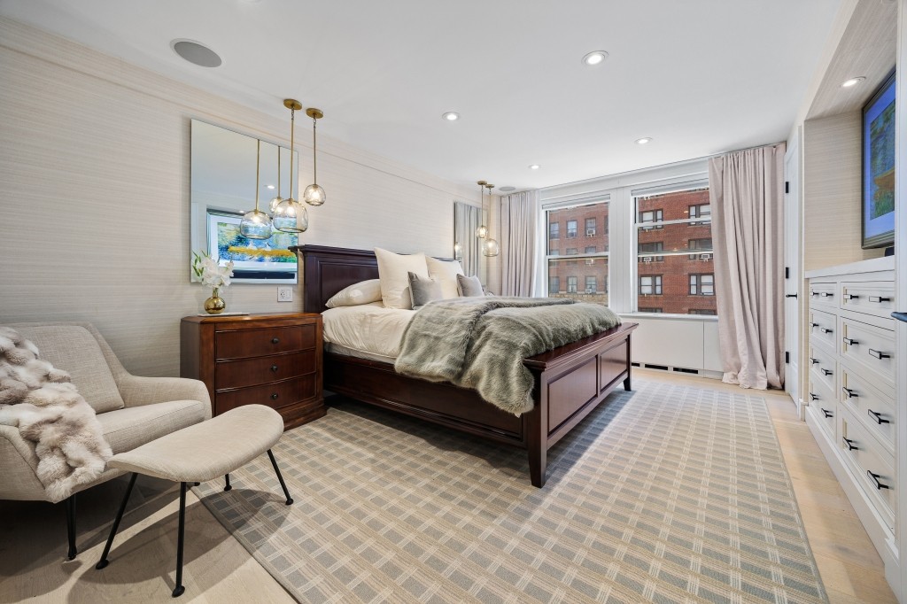 433 West 34th Street, Unit 4ABC Manhattan, NY 10001 - Photo 9 of 20 a living room with a bed furniture and a dresser