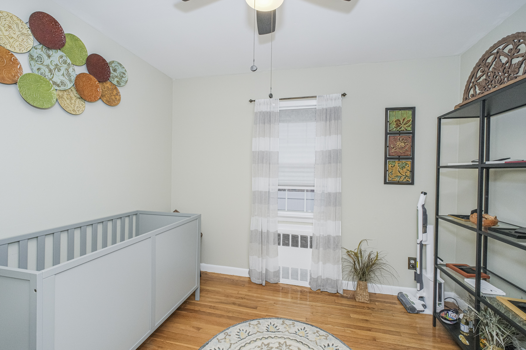 503 Falcon Avenue Staten Island, NY 10306 - Photo 14 of 30 a bedroom with a bed and a wooden floor