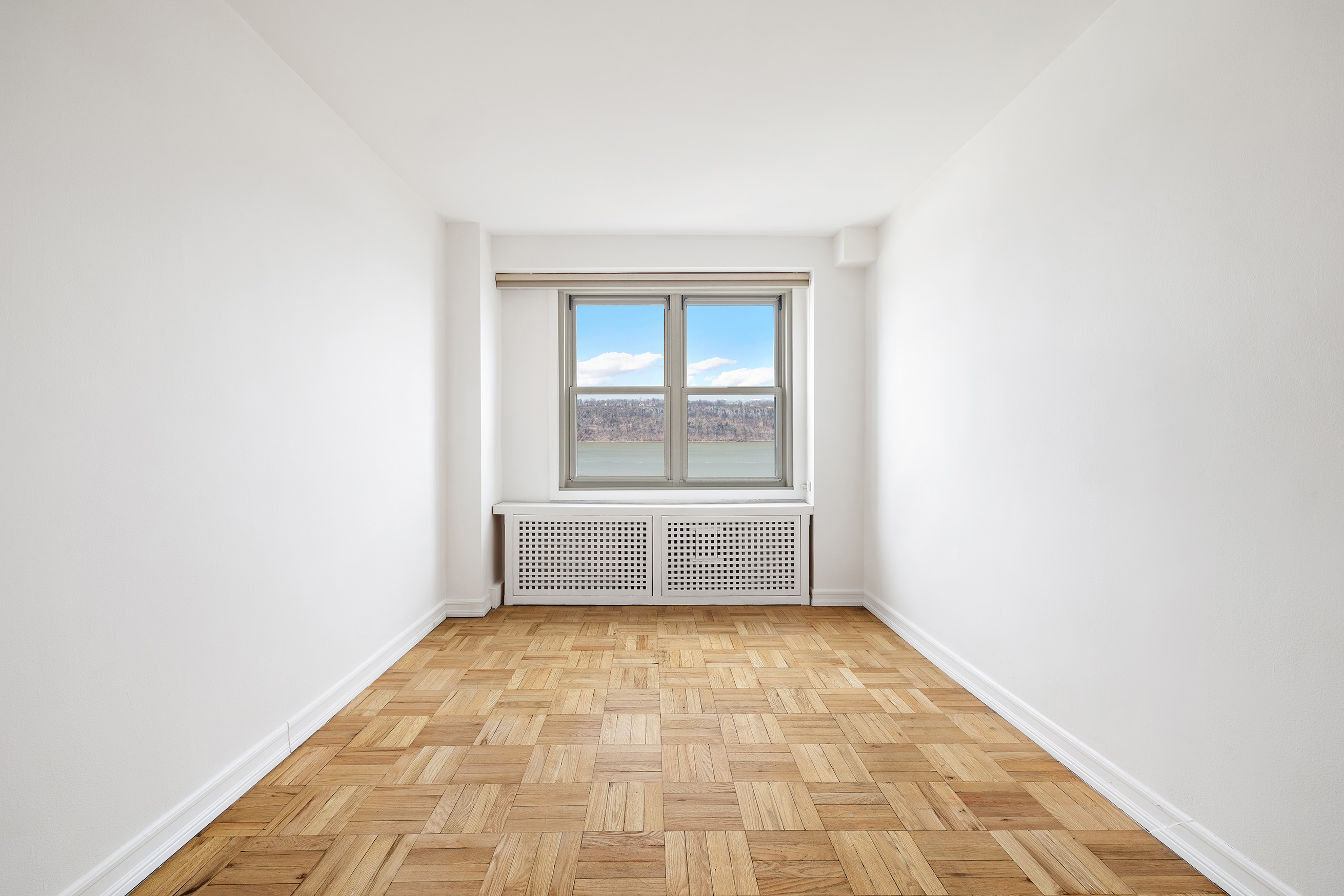 900 West 190th Street, Unit 10O Manhattan, NY 10040 - Photo 7 of 15 a view of an empty room and a window