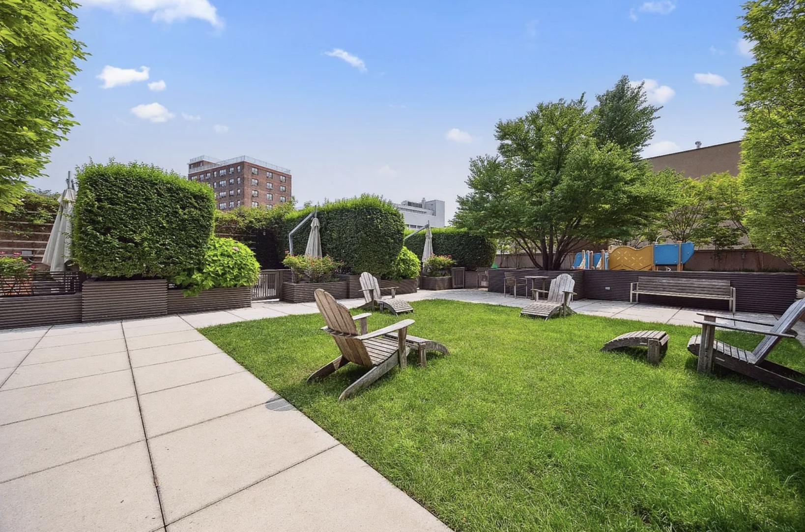215-217 East 96th Street, Unit 26F Manhattan, NY 10128 - Photo 12 of 19 a view of a backyard with sitting area