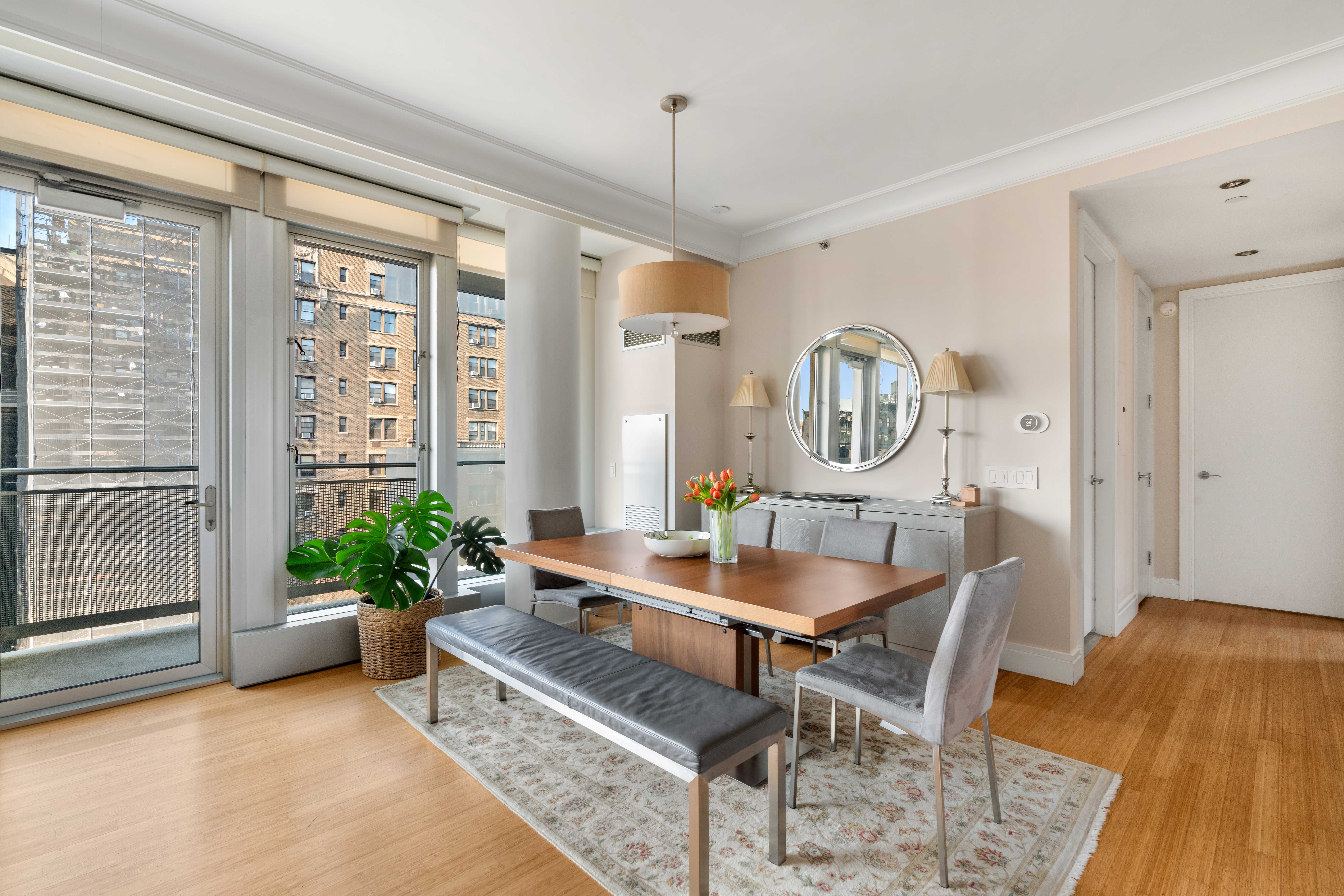 545 West 110th Street, Unit 9D Manhattan, NY 10025 - Photo 3 of 17 a dining room with furniture and window