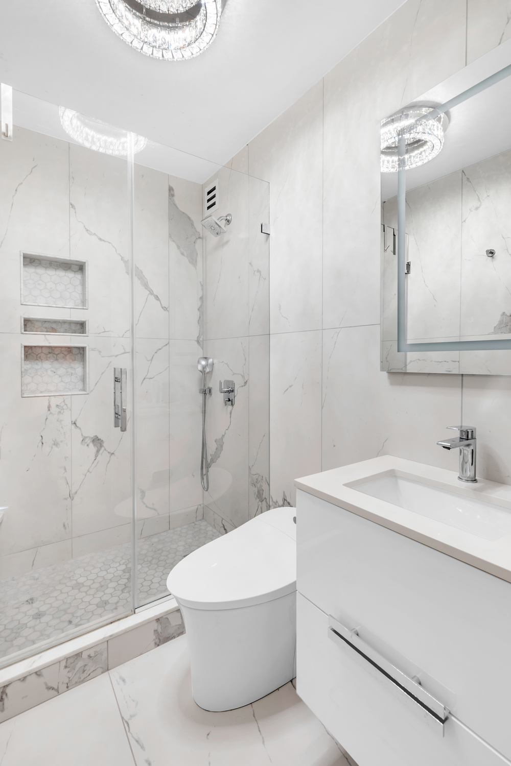 630 1st Avenue, Unit 16JK Manhattan, NY 10016 - Photo 6 of 13 a bathroom with a sink a toilet and shower