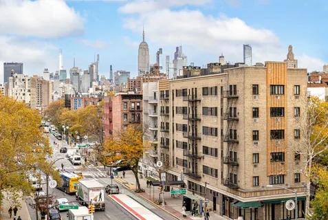a view of a city with tall buildings