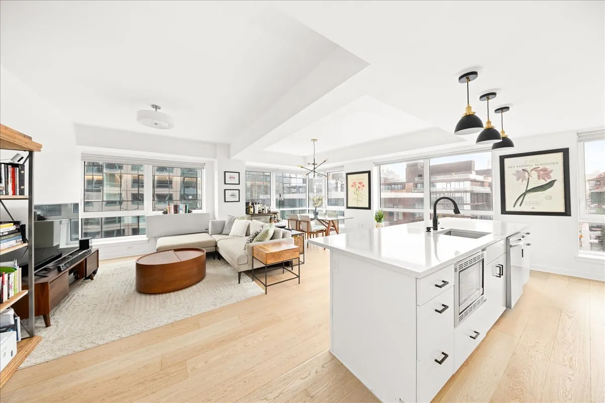 a large white room with lots of white furniture