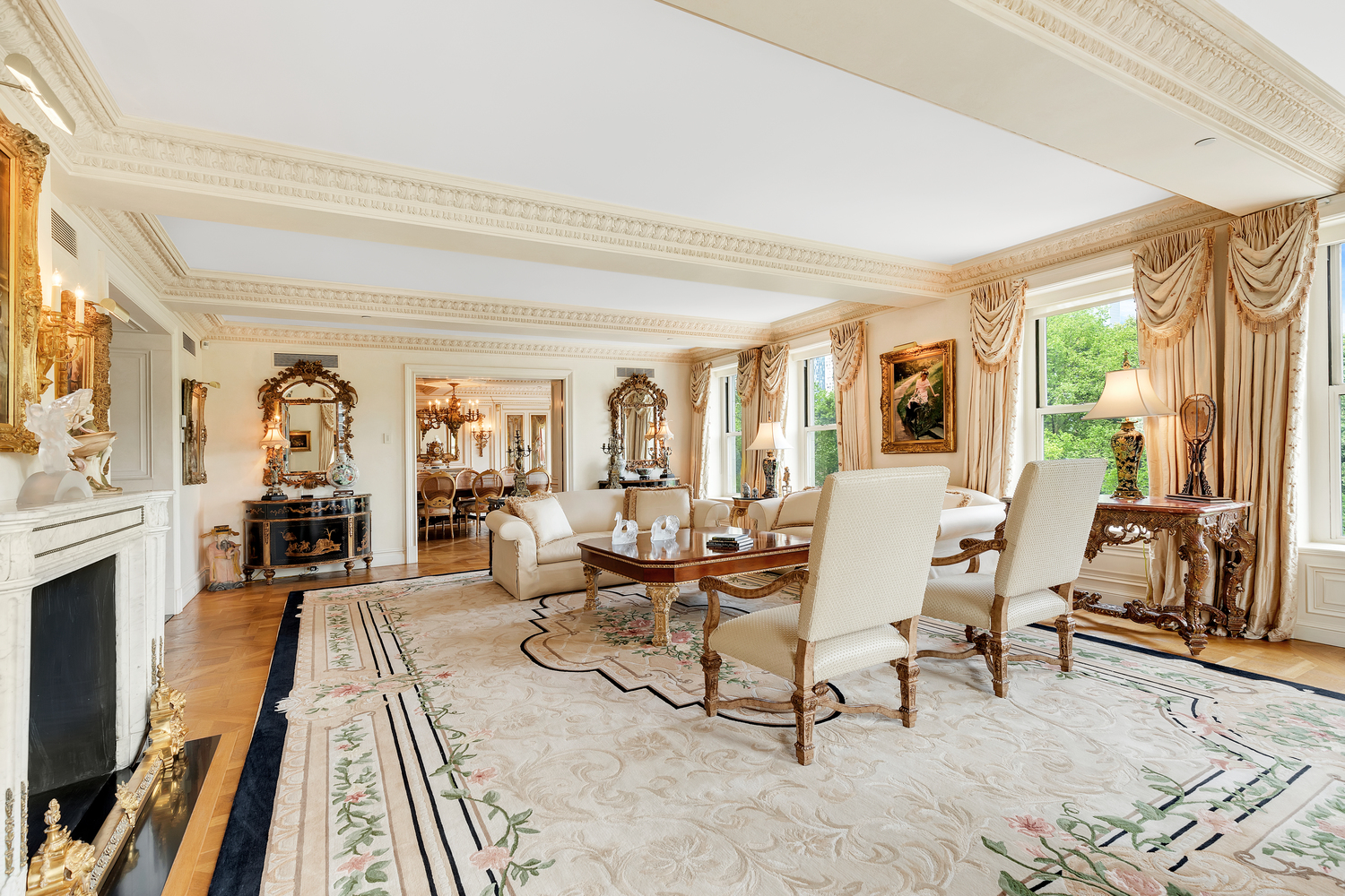 838 5th Avenue, Unit 6 Manhattan, NY 10065 - Photo 4 of 23 a living room with furniture and a fireplace