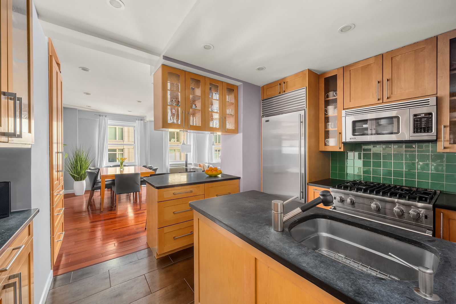 2166 Broadway, Unit 5D Manhattan, NY 10024 - Photo 4 of 11 a kitchen with stainless steel appliances granite countertop a sink a stove and refrigerator