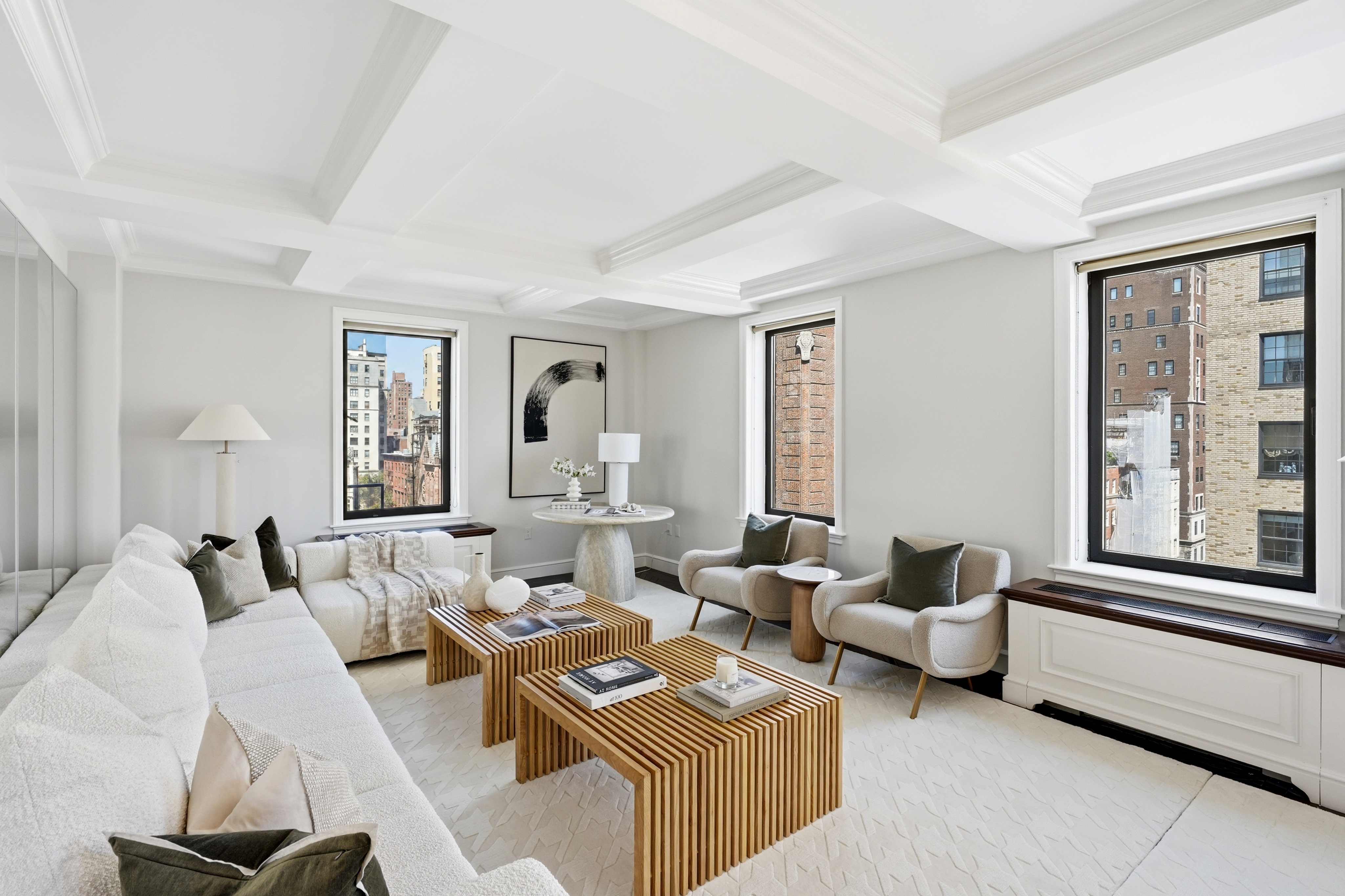 15 East 69th Street, Unit 7A Manhattan, NY 10021 - Photo 3 of 23 a living room with furniture and a large window