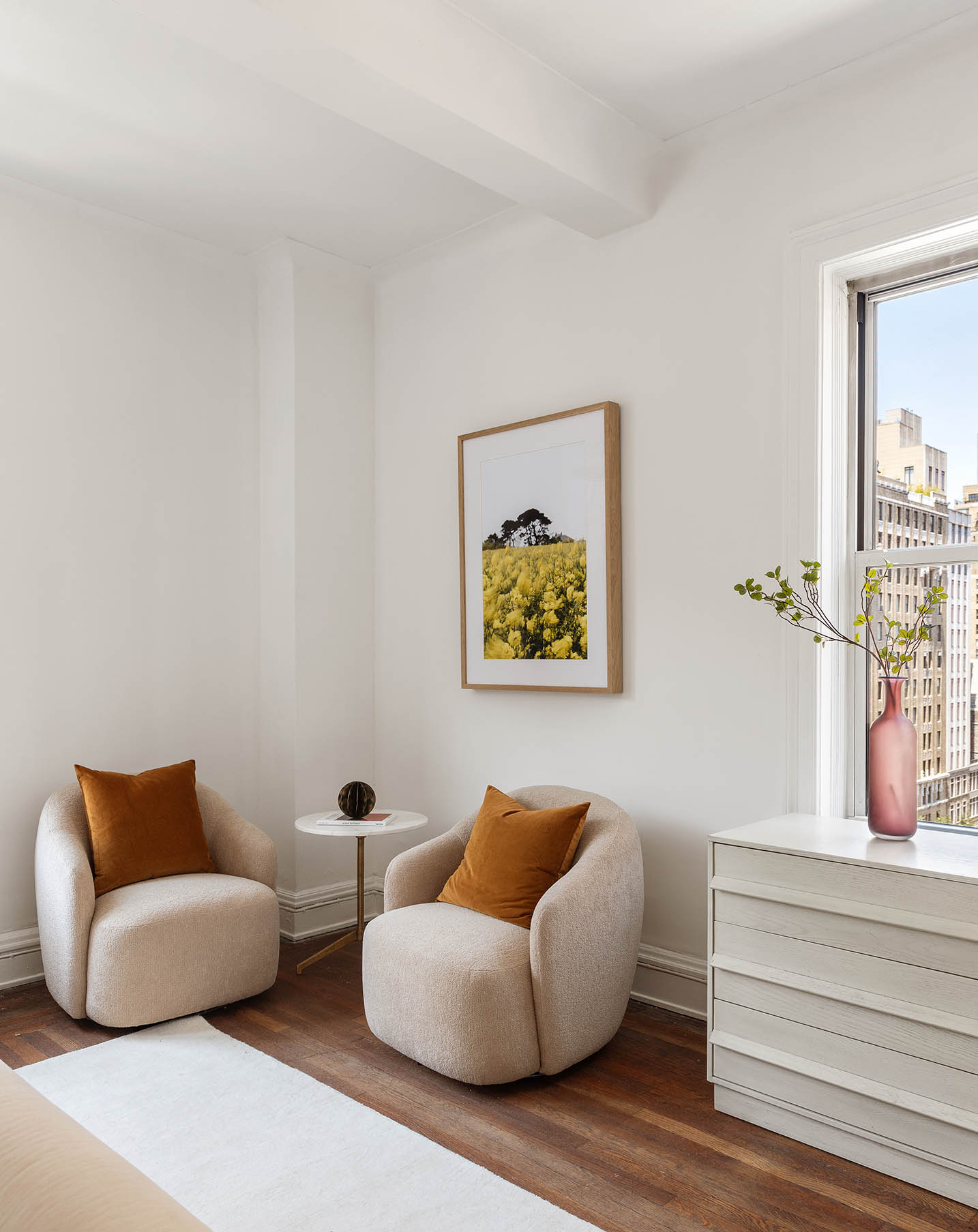 975 Park Avenue, Unit 10B Manhattan, NY 10028 - Photo 9 of 17 a living room with furniture and a potted plant