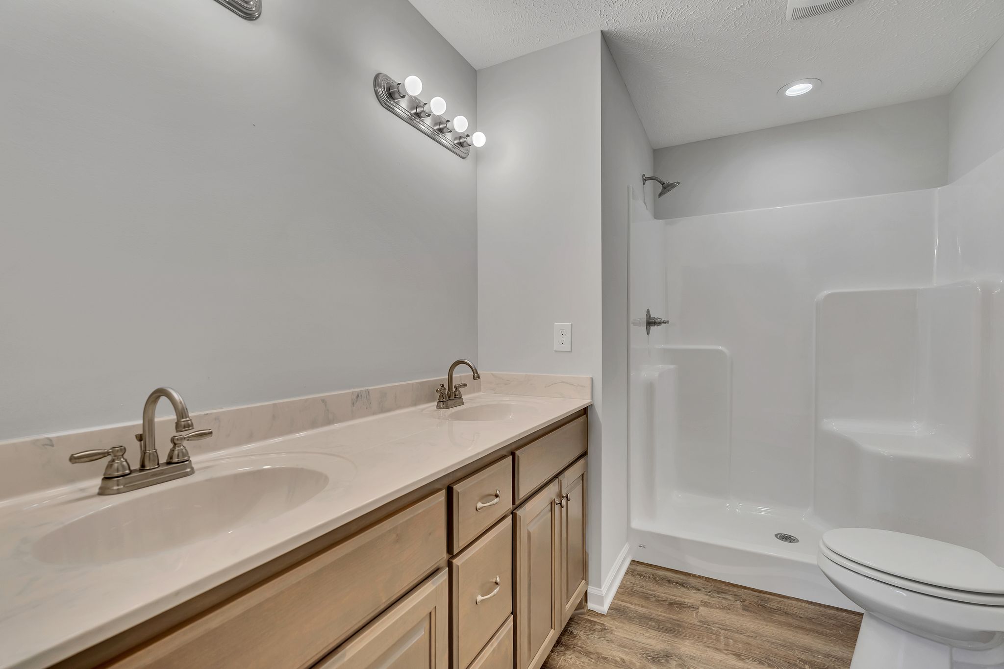 585 Paynes Church Road Estill Springs, TN 37330 - Photo 21 of 34 a bathroom with a sink a toilet and shower