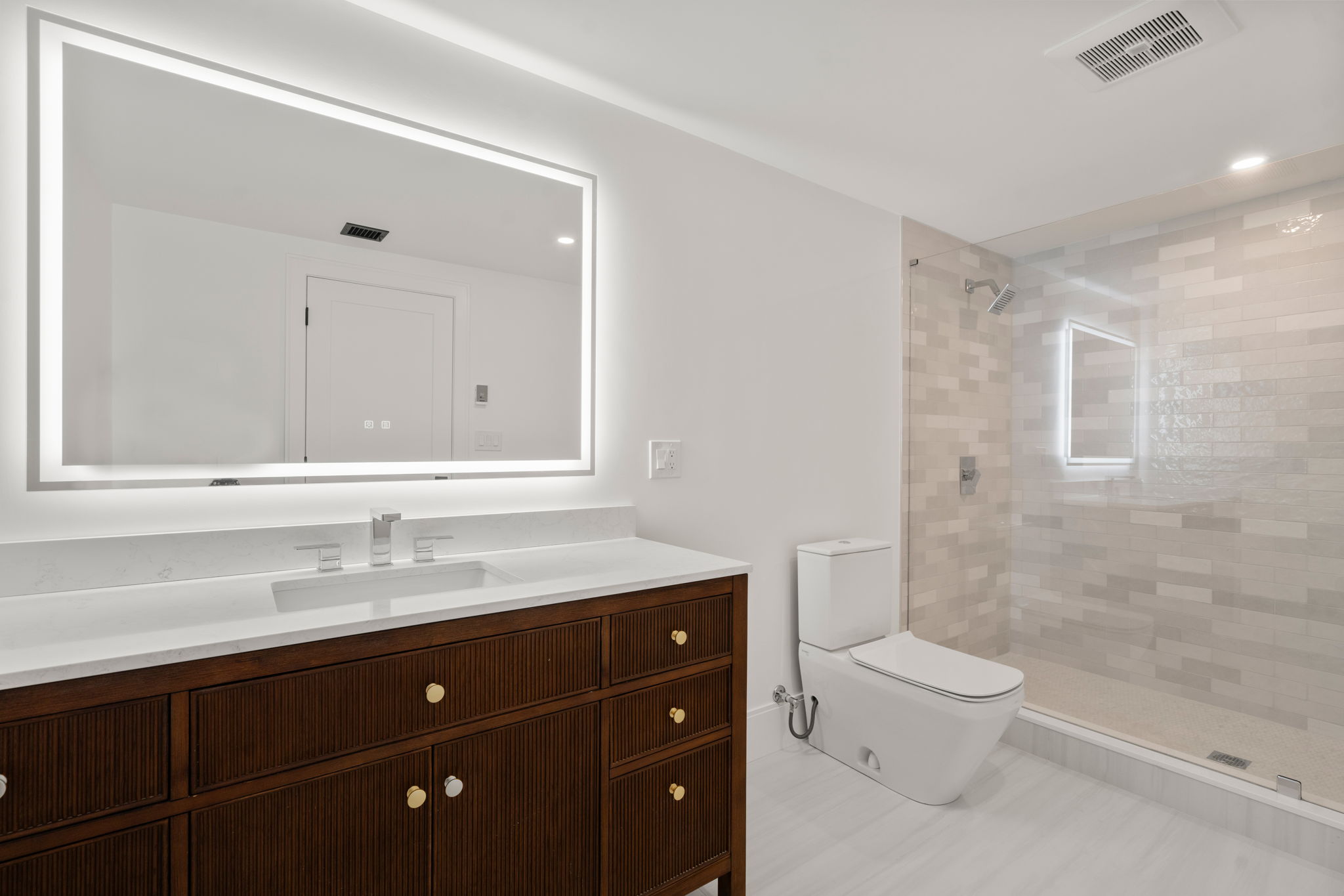 20 Oakland Street Wellesley, MA 02481 - Photo 15 of 30 a bathroom with a sink a toilet and shower