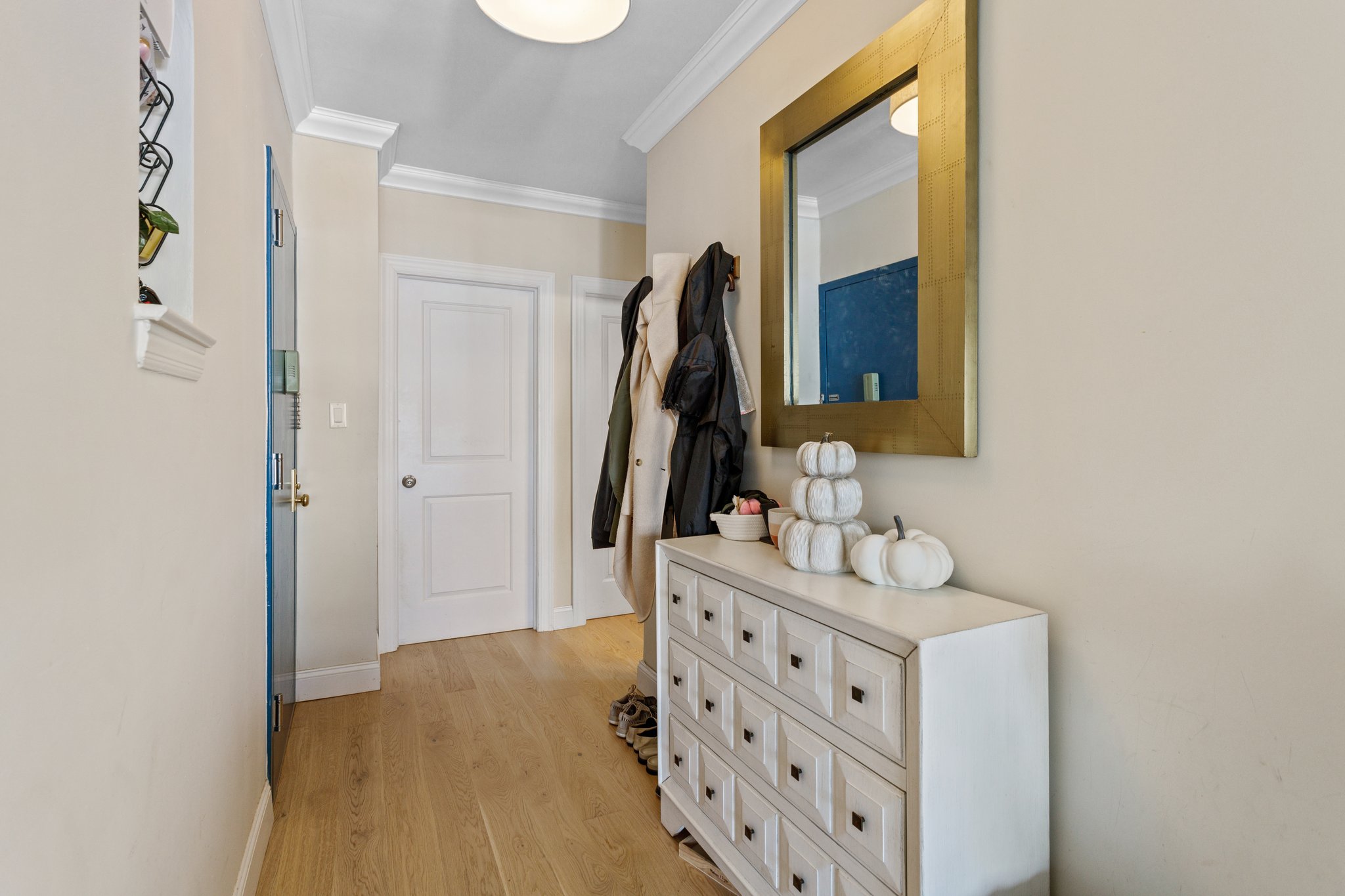 22-45 47th Street, Unit 3 Queens, NY 11105 - Photo 8 of 14 a bathroom with a double vanity sink and mirror
