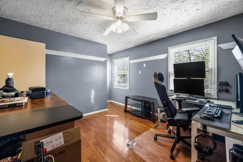 a workspace with furniture and wooden floor