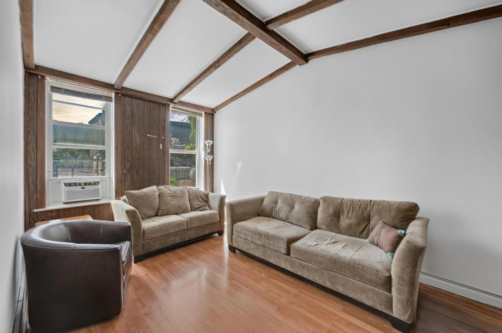 10 Seeley Street Brooklyn, NY 11218 - Photo 11 of 27 a living room with furniture and a couch