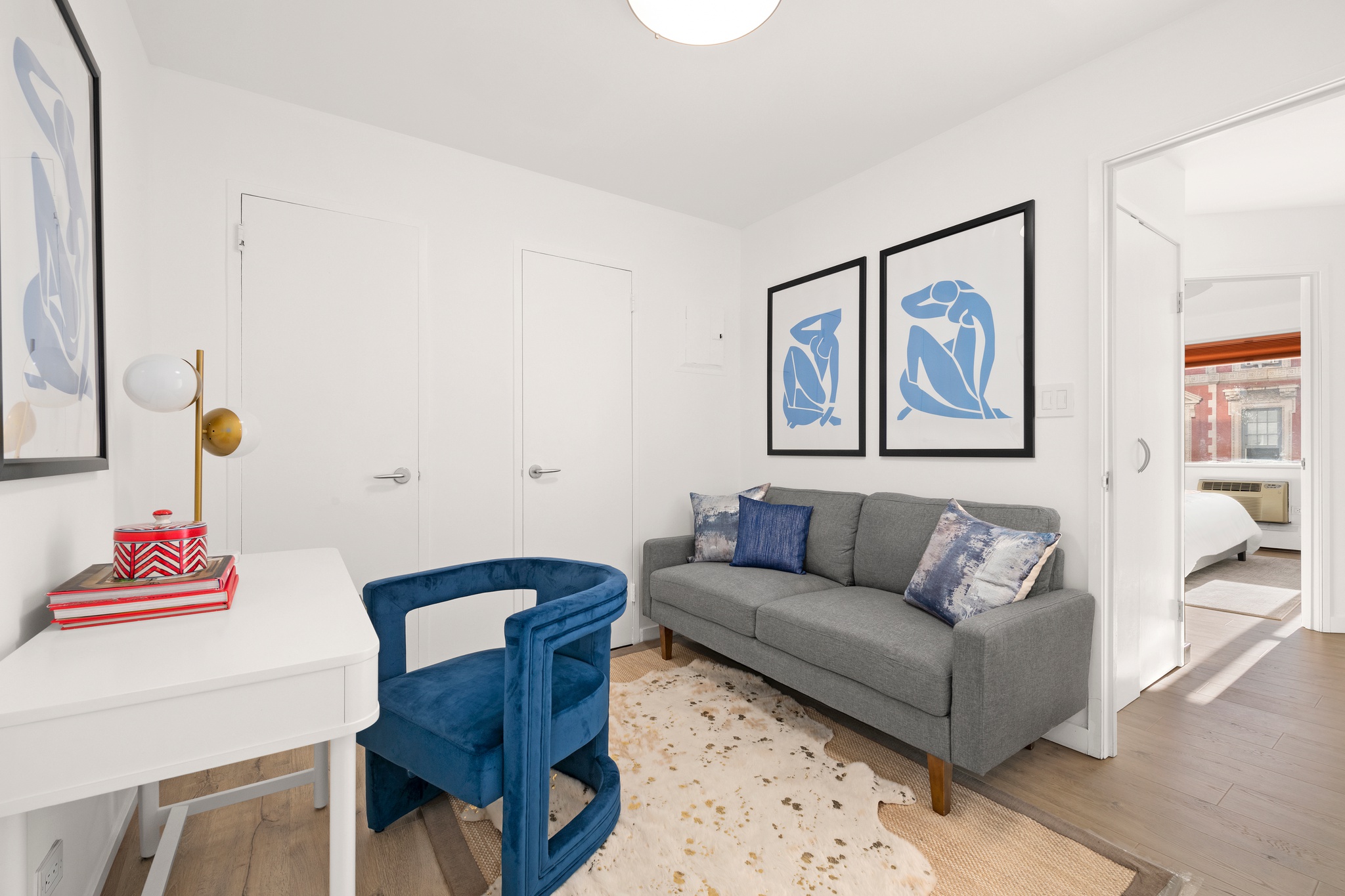 79 West 12th Street, Unit 6BC Manhattan, NY 10011 - Photo 6 of 15 a living room with furniture and a potted plant