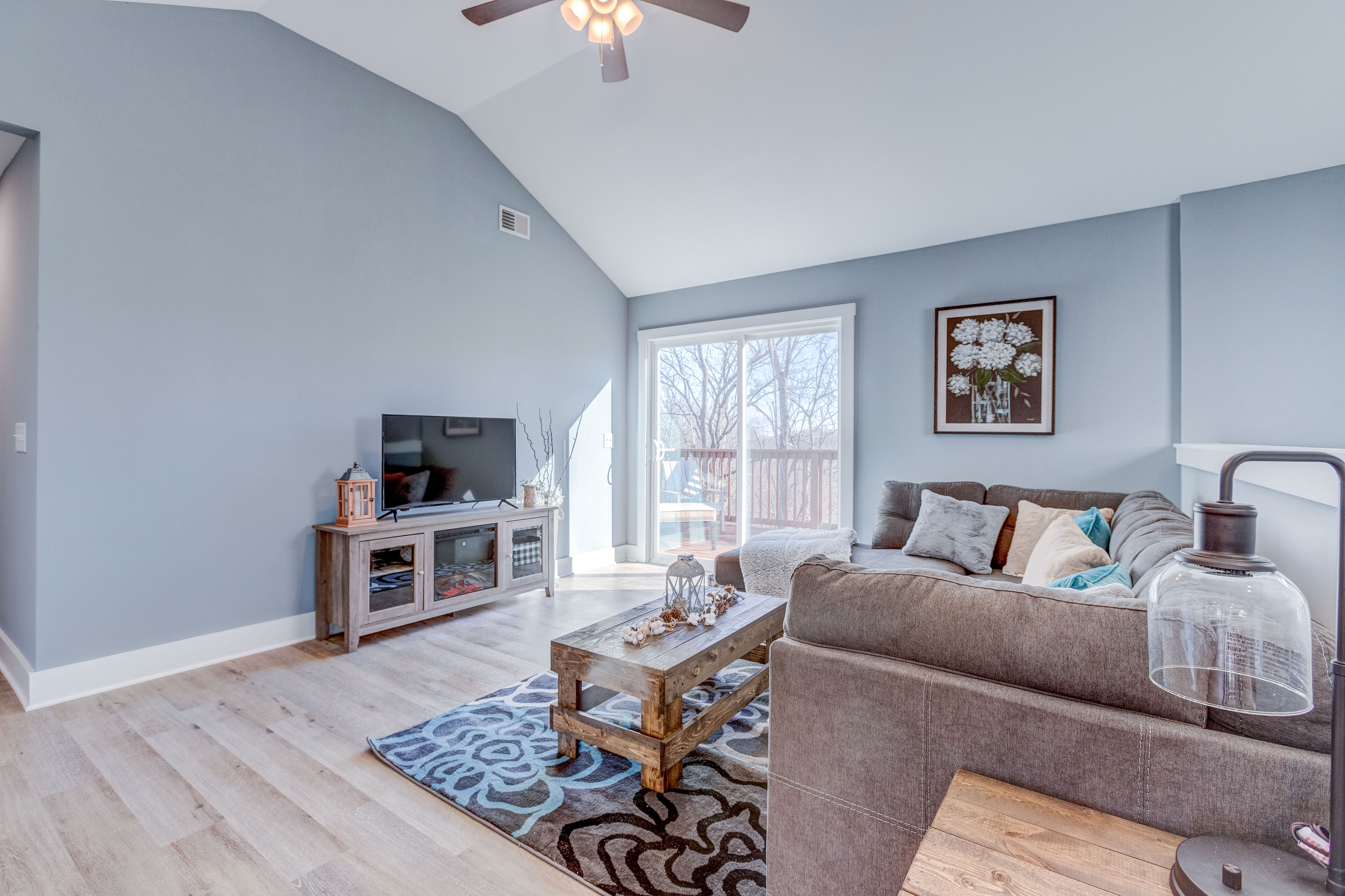 Happy Hollow Road Goodlettsville, TN 37072 - Photo 144 of 203 a living room with furniture a flat screen tv and kitchen view