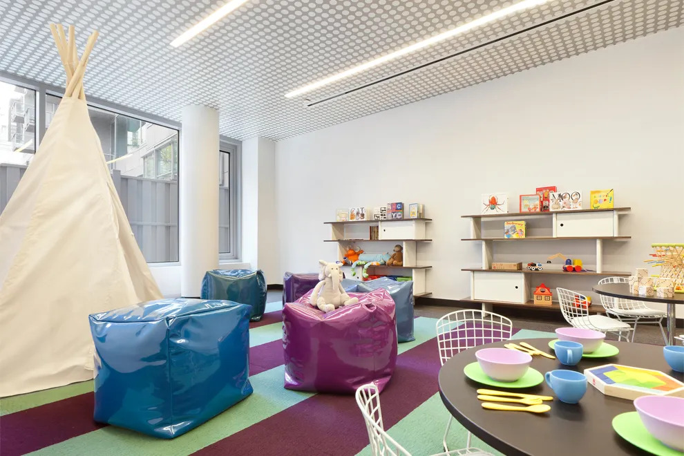 425 West 53rd Street, Unit 419 Manhattan, NY 10019 - Photo 15 of 18 a living room with furniture and a couch