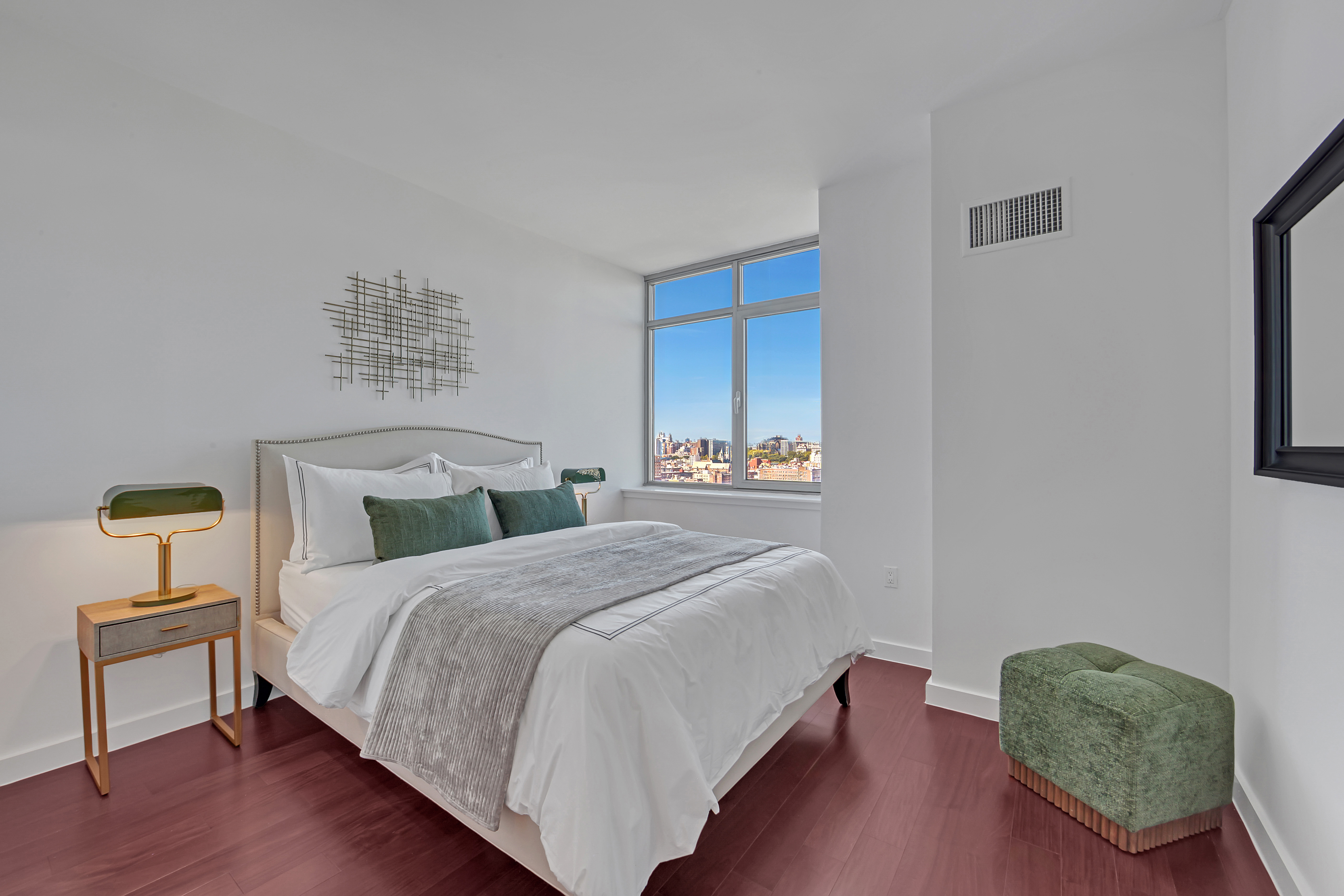 1485 5th Avenue, Unit 18/19H Manhattan, NY 10035 - Photo 10 of 24 a bed room with a bed and a chair